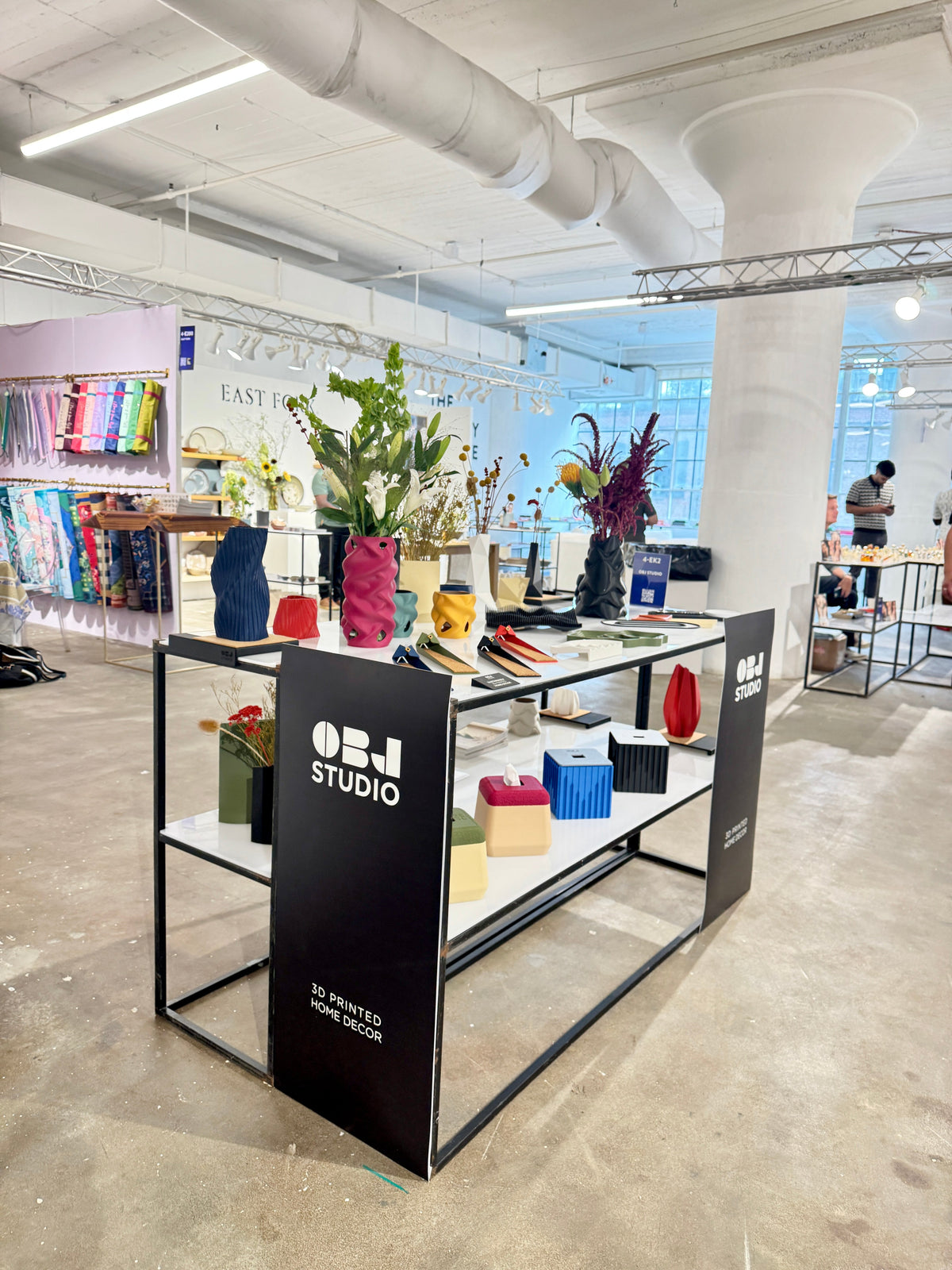 OBJ STUDIO booth at Shoppe Object New York featuring colorful 3D-printed home decor, vases, planters, organizers, and sculptural objects designed in Toronto, Canada.