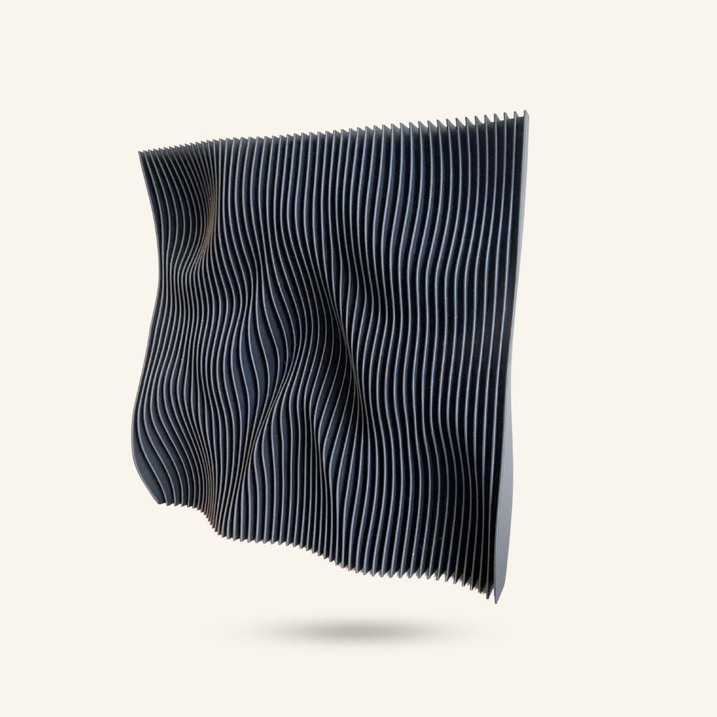 Wave-like black metal shelf on a white background