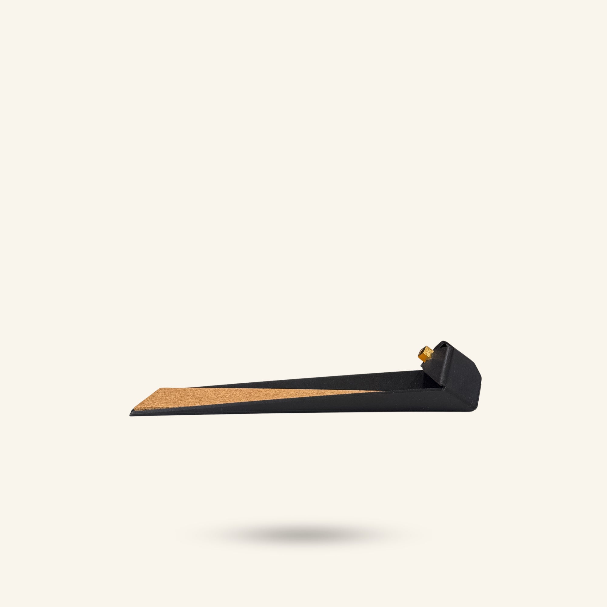 Black door incense holder with cork base on a white background