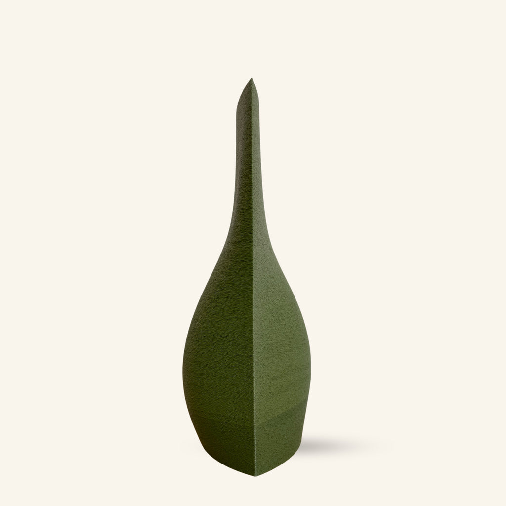 Green vase with a unique shape on a white background