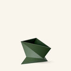 Green geometric planter on a white background